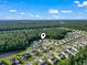 Picturesque aerial view of a beautiful residential neighborhood surrounded by lush green trees and water features at 812 Buteo Ct., Myrtle Beach, SC 29588