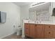 Bathroom featuring a toilet, vanity, and a large mirror at 812 Buteo Ct., Myrtle Beach, SC 29588