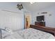 Cozy bedroom featuring a ceiling fan, closet, and television at 812 Buteo Ct., Myrtle Beach, SC 29588