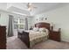 Relaxing bedroom with carpet flooring, ceiling fan, and large window at 812 Buteo Ct., Myrtle Beach, SC 29588