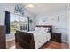 Bright bedroom with large window, vaulted ceiling, and coastal-themed decor at 812 Buteo Ct., Myrtle Beach, SC 29588