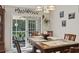 Cozy dining room with sliding glass doors that let in natural light and give access to the patio at 812 Buteo Ct., Myrtle Beach, SC 29588