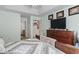 Comfortable primary bedroom with tray ceiling, dresser, and neutral decor for a serene retreat at 812 Buteo Ct., Myrtle Beach, SC 29588