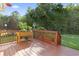 Outdoor deck area with wooden railing, planter box, and scenic backyard views at 812 Buteo Ct., Myrtle Beach, SC 29588