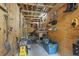 Spacious garage or storage area with exposed wood beams, work bench and tools for organization at 812 Buteo Ct., Myrtle Beach, SC 29588
