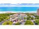 Aerial view of ocean front club with a private beach and surrounding green trees at 9012 Mabel Ct., Longs, SC 29568