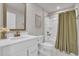 Clean bathroom featuring a tub/shower, white vanity and bronze fixtures at 9012 Mabel Ct., Longs, SC 29568