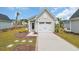 Charming home with a well-manicured lawn and two-car garage at 9012 Mabel Ct., Longs, SC 29568