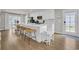 Contemporary kitchen featuring a large island with barstool seating, stainless steel appliances, and ample counter space at 9012 Mabel Ct., Longs, SC 29568