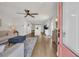 Open-concept living area with hardwood floors and lots of natural light, flowing seamlessly into the kitchen at 9012 Mabel Ct., Longs, SC 29568