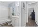 Well-lit bathroom featuring a tub/shower, a vanity with storage, and coastal-themed decorations at 9501 Shore Dr. # B-316, Myrtle Beach, SC 29572