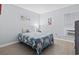Bright bedroom featuring a cozy bed with a surfboard-themed comforter and soft blue walls at 9501 Shore Dr. # B-316, Myrtle Beach, SC 29572