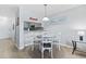 A dining area has a round table with seating for four, adjacent to the modern kitchen at 9501 Shore Dr. # B-316, Myrtle Beach, SC 29572