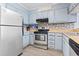 Updated kitchen with stainless steel appliances and blue cabinets at 9501 Shore Dr. # B-316, Myrtle Beach, SC 29572