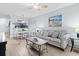 A comfortable living area boasts a sofa, coffee table, and a view into the adjacent dining area at 9501 Shore Dr. # B-316, Myrtle Beach, SC 29572