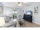 This living area features comfortable seating, a TV, and a sliding door to a balcony at 9501 Shore Dr. # B-316, Myrtle Beach, SC 29572