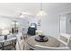 The living area includes a dining table, comfortable seating, and sliding glass doors to a balcony at 9501 Shore Dr. # B-316, Myrtle Beach, SC 29572
