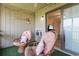 Inviting screened patio with comfortable chairs, a ceiling fan, and easy access to the interior via a sliding glass door at 9501 Shore Dr. # B-316, Myrtle Beach, SC 29572