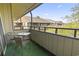 Patio featuring outdoor table and chairs, overlooking lush foliage at 9501 Shore Dr. # B-316, Myrtle Beach, SC 29572