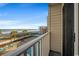 Balcony view of the ocean and beach, with lounge chairs and palm trees below at 9570 Shore Dr. # 204, Myrtle Beach, SC 29572