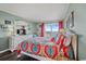 Inviting bedroom with a balcony overlooking the ocean, colorful bedding, and an abundance of nautically-themed decor at 9570 Shore Dr. # 204, Myrtle Beach, SC 29572