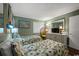 Charming bedroom featuring twin beds, a peacock chair, and relaxing natural light at 9570 Shore Dr. # 204, Myrtle Beach, SC 29572