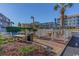 Exterior common area with picnic tables and charcoal grills at 9570 Shore Dr. # 204, Myrtle Beach, SC 29572