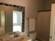 Bright bathroom featuring a vanity, mirror, toilet, shower, and tiled floors, as seen from doorway at 9739 Leyland Dr. # 12, Myrtle Beach, SC 29572