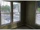 Sunlit bedroom with three windows providing ample natural light at 9739 Leyland Dr. # 12, Myrtle Beach, SC 29572