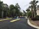 Community entrance gate with security features and lush landscaping at 9739 Leyland Dr. # 12, Myrtle Beach, SC 29572