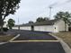 Exterior view of multiple garages with neutral siding, asphalt drive, and landscaping at 9739 Leyland Dr. # 12, Myrtle Beach, SC 29572
