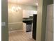 Kitchen featuring tiled flooring, stainless steel appliances, and a chandelier adding a touch of elegance at 9739 Leyland Dr. # 12, Myrtle Beach, SC 29572