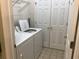 Convenient laundry room features white appliances and tile flooring, with ample closet space for storage at 9739 Leyland Dr. # 12, Myrtle Beach, SC 29572