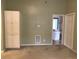 Room with beige walls, carpeted floor, and built in storage beside the doorway to the connected bathroom at 9739 Leyland Dr. # 12, Myrtle Beach, SC 29572