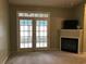 Cozy living room with fireplace and double doors providing natural light at 9739 Leyland Dr. # 12, Myrtle Beach, SC 29572