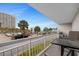 Enjoy balcony views of the palm trees and distant beach from the cozy balcony space at 9820 Queensway Blvd. # 105, Myrtle Beach, SC 29572
