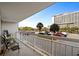 Balcony offers parking views and a glimpse of the ocean at 9820 Queensway Blvd. # 105, Myrtle Beach, SC 29572