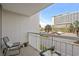 Comfortable condo balcony with chair and table; perfect for enjoying your morning coffee at 9820 Queensway Blvd. # 105, Myrtle Beach, SC 29572