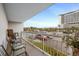 Relax on the balcony with comfortable seating and views of the parking and nearby hotels at 9820 Queensway Blvd. # 105, Myrtle Beach, SC 29572