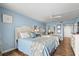 Light and airy bedroom featuring two beds and tasteful decorations for a restful stay at 9820 Queensway Blvd. # 105, Myrtle Beach, SC 29572