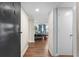 Inviting hallway leading to a bright living area with hardwood floors at 9820 Queensway Blvd. # 105, Myrtle Beach, SC 29572