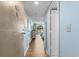 Hallway with door leading to bedroom with a view of the beach from the sliding glass doors at 9820 Queensway Blvd. # 105, Myrtle Beach, SC 29572