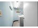 Convenient laundry room equipped with a washer, dryer, and beach-themed decorations at 9820 Queensway Blvd. # 105, Myrtle Beach, SC 29572