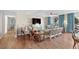 Cozy living room featuring beachy decor, ceiling fan, and access to balcony at 9820 Queensway Blvd. # 105, Myrtle Beach, SC 29572