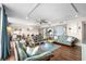 Spacious living area with hardwood floors, ceiling fan and ocean views at 9820 Queensway Blvd. # 105, Myrtle Beach, SC 29572