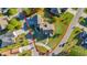 An aerial view showcases the layout of the home, spacious backyard, and surrounding neighborhood at 107 Long Bay Golf Pl., Longs, SC 29568