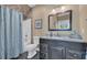 Elegant bathroom with a modern vanity, tiled floors, and a shower-tub combo, perfect for relaxation at 107 Long Bay Golf Pl., Longs, SC 29568