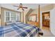 Inviting bedroom with a four-poster bed, a large window, and ensuite access, perfect for relaxation at 107 Long Bay Golf Pl., Longs, SC 29568