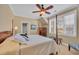 Cozy bedroom with natural light and neutral paint, featuring a four poster bed at 107 Long Bay Golf Pl., Longs, SC 29568