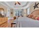 This bedroom boasts natural light, a wooden bed frame, and ample space for relaxation and rest at 107 Long Bay Golf Pl., Longs, SC 29568